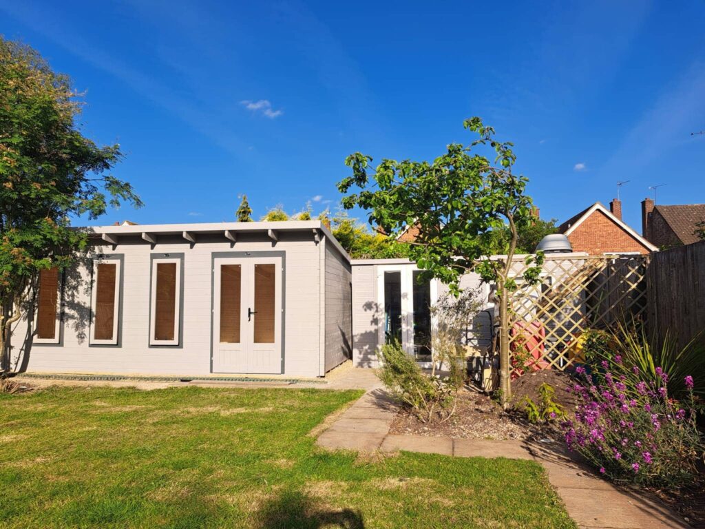 Freshly painted grey garden shed with a sleek, modern look.