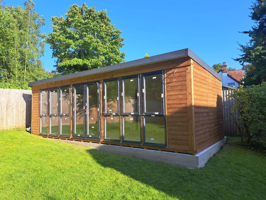 Garden shed with freshly installed windows, adding a polished touch.