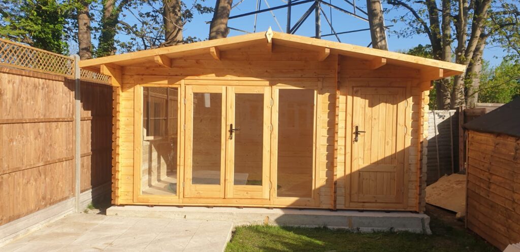 Freshly finished wooden garden cabin with a natural, rustic look.